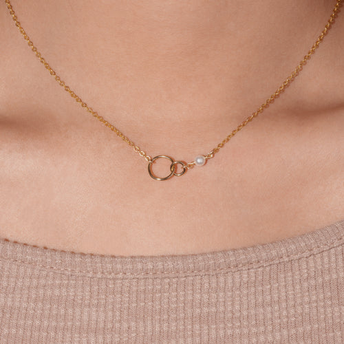 Cartier Rose Gold and Diamond Interlocking LOVE Necklace | Harrods IE