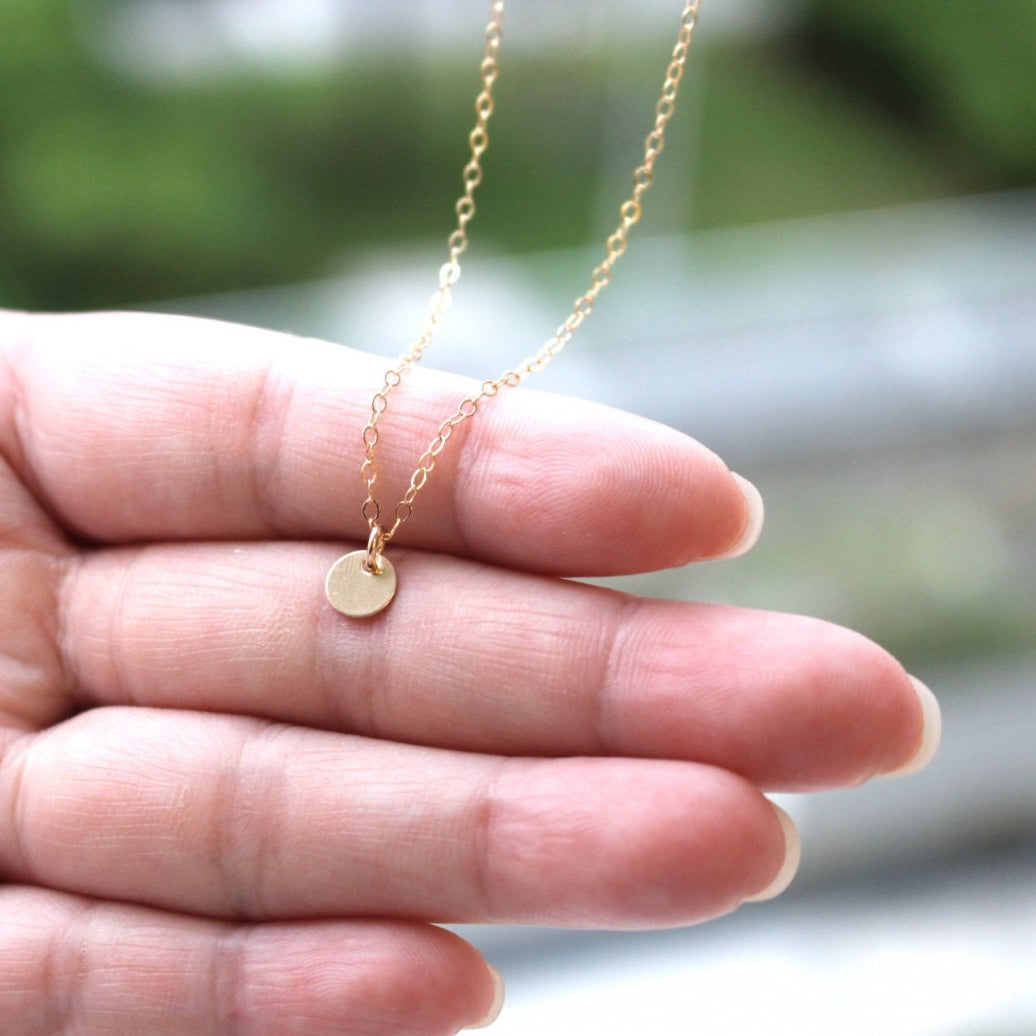 Tiny gold disc on sale necklace